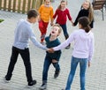 Group of smiling glad children playing red rover Royalty Free Stock Photo