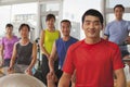 Group of smiling happy people exercising in the gym, portrait Royalty Free Stock Photo