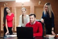Group of smiling inspired young business people working together in office. Royalty Free Stock Photo