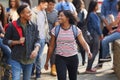 Group Of Smiling Male And Female College Students Walking And Chatting Outside School Building Royalty Free Stock Photo