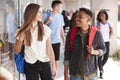 Group Of Smiling Male And Female College Students Walking In School Building Corridor Royalty Free Stock Photo