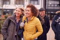 Group Of Smiling Mature Students Walking Outside College Building Royalty Free Stock Photo