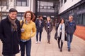 Group Of Smiling Mature Students Walking Outside College Building Royalty Free Stock Photo