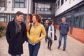 Group Of Smiling Mature Students Walking Outside College Building Royalty Free Stock Photo