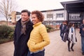 Group Of Smiling Mature Students Walking Outside College Building Royalty Free Stock Photo