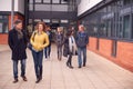 Group Of Smiling Mature Students Walking Outside College Building Royalty Free Stock Photo