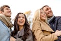 Group of smiling men and women in autumn park Royalty Free Stock Photo