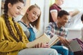 Group of smiling multicultural teenage schoolchildren