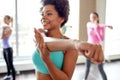 Group of smiling people dancing in gym or studio Royalty Free Stock Photo