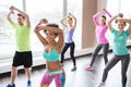 Group of smiling people dancing in gym or studio Royalty Free Stock Photo