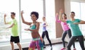 Group of smiling people dancing in gym or studio Royalty Free Stock Photo