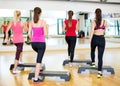 Group of smiling people doing aerobics Royalty Free Stock Photo