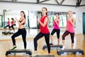 Group of smiling people doing aerobics Royalty Free Stock Photo