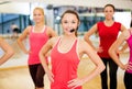 Group of smiling people exercising in the gym Royalty Free Stock Photo