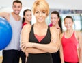 Group of smiling people exercising in the gym Royalty Free Stock Photo