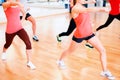 Group of smiling people exercising in the gym Royalty Free Stock Photo