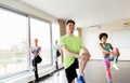 Group of smiling people exercising in gym Royalty Free Stock Photo