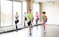 Group of smiling people exercising in gym Royalty Free Stock Photo