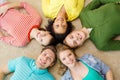 Group of smiling people lying down on floor Royalty Free Stock Photo