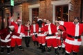 Group smiling Santas party New Orleans