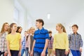 Group of smiling school kids walking in corridor Royalty Free Stock Photo