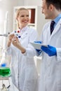Group of smiling scientist analyzing molecular structure Royalty Free Stock Photo