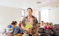 Group of smiling students in lecture hall Royalty Free Stock Photo