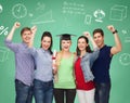 Group of smiling students over green board Royalty Free Stock Photo