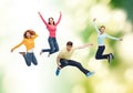 Group of smiling teenagers jumping in air Royalty Free Stock Photo