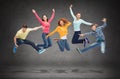 Group of smiling teenagers jumping in air Royalty Free Stock Photo