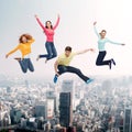 Group of smiling teenagers jumping in air Royalty Free Stock Photo