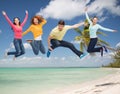 Group of smiling teenagers jumping in air Royalty Free Stock Photo