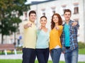 Group of smiling teenagers over campus background Royalty Free Stock Photo