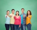 Group of smiling teenagers over green board Royalty Free Stock Photo