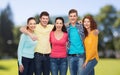 Group of smiling teenagers over green park Royalty Free Stock Photo