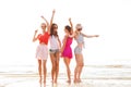 Group of smiling women dancing on beach Royalty Free Stock Photo