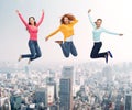 Group of smiling women jumping in air Royalty Free Stock Photo