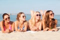Group of smiling women in sunglasses on beach Royalty Free Stock Photo