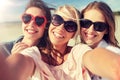 Group of smiling women taking selfie on beach Royalty Free Stock Photo