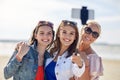 Group of smiling women taking selfie on beach Royalty Free Stock Photo