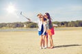 Group of smiling women taking selfie on beach Royalty Free Stock Photo