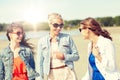 Group of smiling young female friends on beach Royalty Free Stock Photo