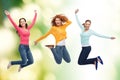 Group of smiling young women jumping in air Royalty Free Stock Photo