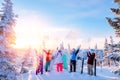 Group of snowboarders and skier dawn with snowboards rejoice snow Light sun in winter forest sunrise. Concept life style