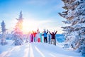Group of snowboarders and skier dawn with snowboards rejoice snow Light sun in winter forest sunrise. Concept life style