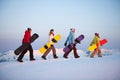 Group of snowboarders on top of the mountain