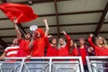 Group of soccer fans watching a sports event in the stands of a stadium Royalty Free Stock Photo