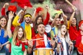 Group of soccer fans watching a sports event in the stands of a stadium Royalty Free Stock Photo