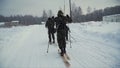 Group of soldiers run on skis in the woods with weapons. Clip. Soldiers with AK-47 rifles and grenade launchers running Royalty Free Stock Photo