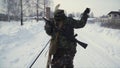 Group of soldiers run on skis in the woods with weapons. Clip. Soldiers with AK-47 rifles and grenade launchers running Royalty Free Stock Photo